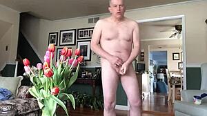 Mature daddy strips and jerks off in front of the camera