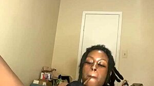 Ebony MILF masturbates with dildo and smokes